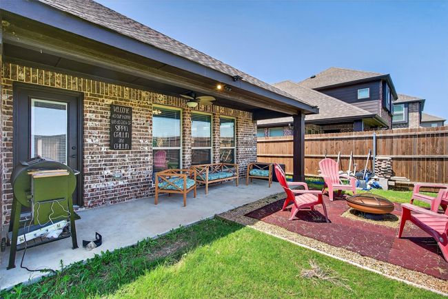 View of patio / terrace featuring an outdoor fire pit | Image 32