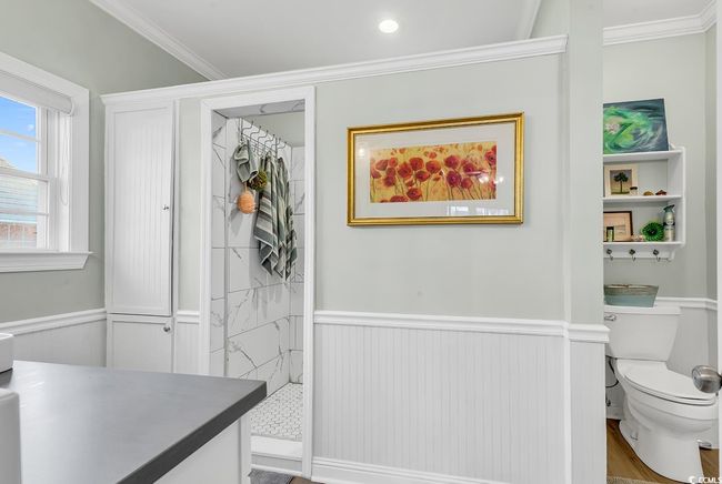 Bathroom featuring hardwood / wood-style flooring, ornamental molding, and vanity | Image 23