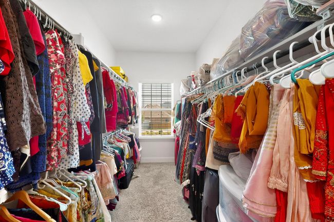 Walk in closet featuring carpet flooring | Image 30