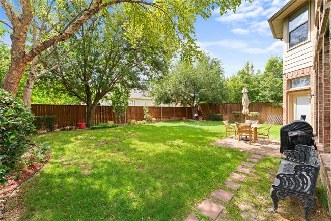 Fenced backyard featuring a patio | Image 36