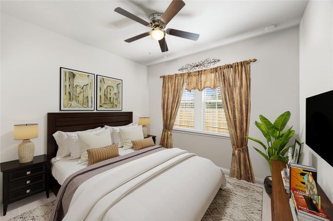 Well-sized secondary bedroom with plush carpet, neutral paint, and a large window that brings in natural light. *Virtually Staged | Image 16
