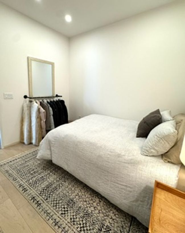 Bedroom with recessed lighting and wood finished floors | Image 13