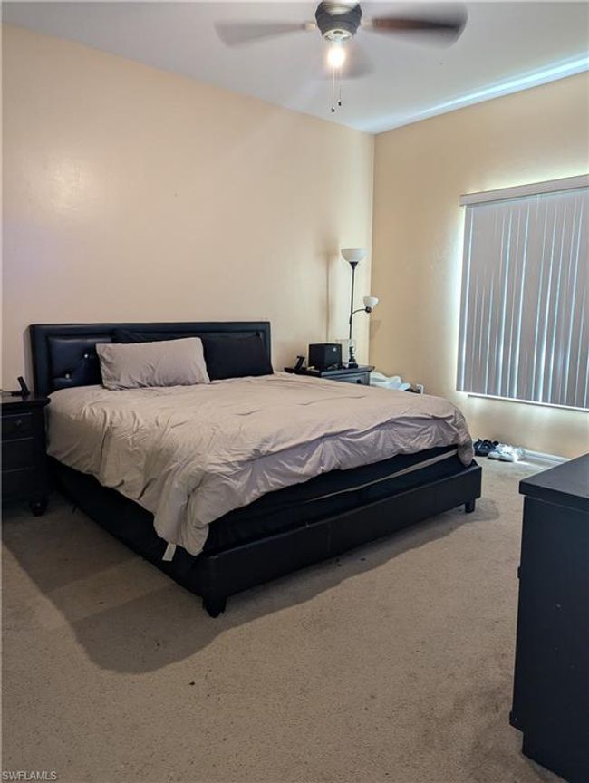 Bedroom with carpet flooring and ceiling fan | Image 8