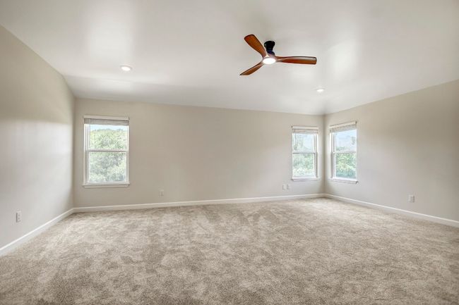 Primary bedroom with lots of light and ceiling fan | Image 31