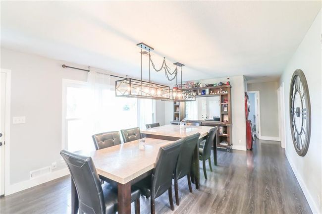 Dining room featuring dark wood finished floors and baseboards | Image 20