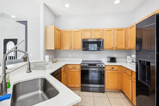 Kitchen with Large Countertopss and Ample Storage | Image 12