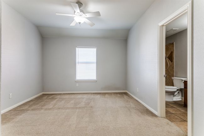 Empty room with carpet floors and ceiling fan | Image 21