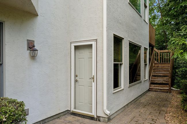 Enjoy seamless indoor-outdoor living with walkout access to a picturesque backyard and patio. | Image 33