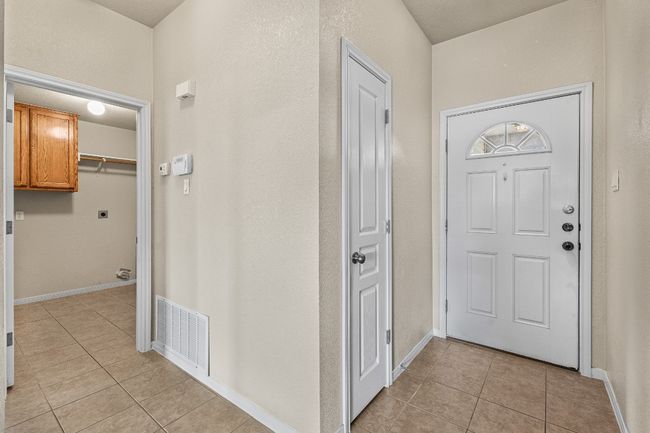 Entrance foyer featuring light tile patterned floors | Image 6