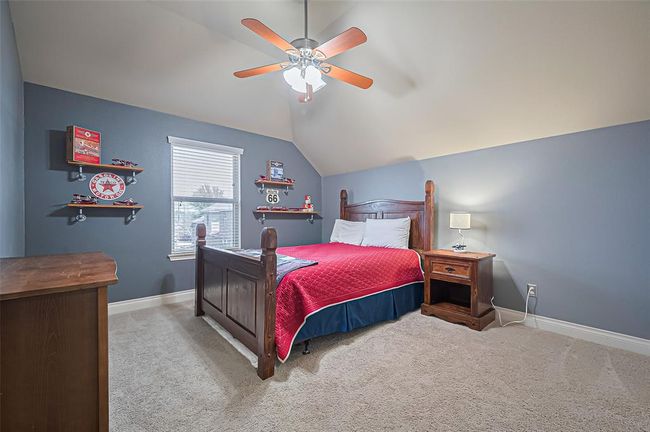 Upstairs, you’ll find three additionalbedrooms. Each bedroom is thoughtfullyappointed with plush carpeting, aspacious closet, and picture windowsthat fill the rooms with natural light. | Image 36