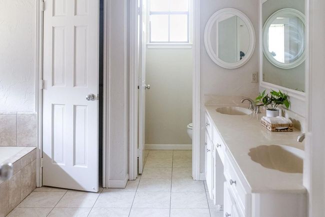 Primary bathroom with dual sinks. His/Hers closet | Image 13