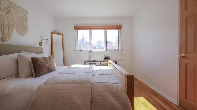 Bedroom featuring light wood finished floors and baseboards | Image 11