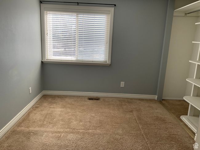 Unfurnished room featuring visible vents, baseboards, and carpet | Image 15