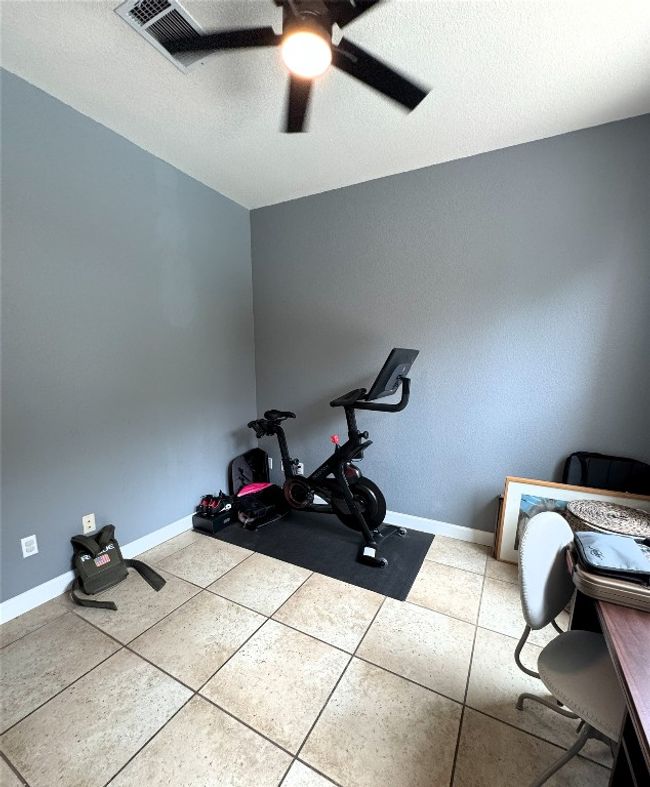 Laundry room is large enough to include a home gym. | Image 14