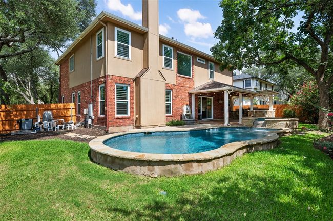 Back of property with a fenced backyard, brick siding, and a patio | Image 36