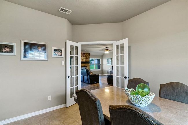 Tiled dining area featuring ceiling fan and french doors | Image 17