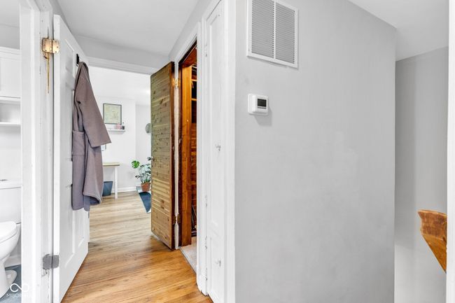 corridor with light wood finished floors | Image 34