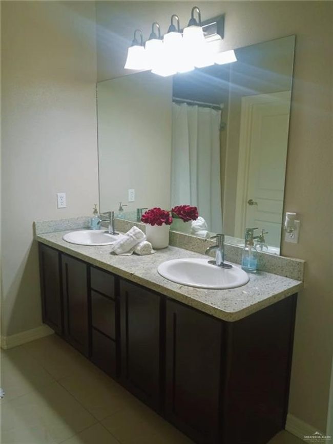 Bathroom featuring double vanity and tile patterned flooring | Image 10