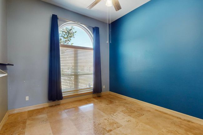 Spare room featuring baseboards and a ceiling fan | Image 33