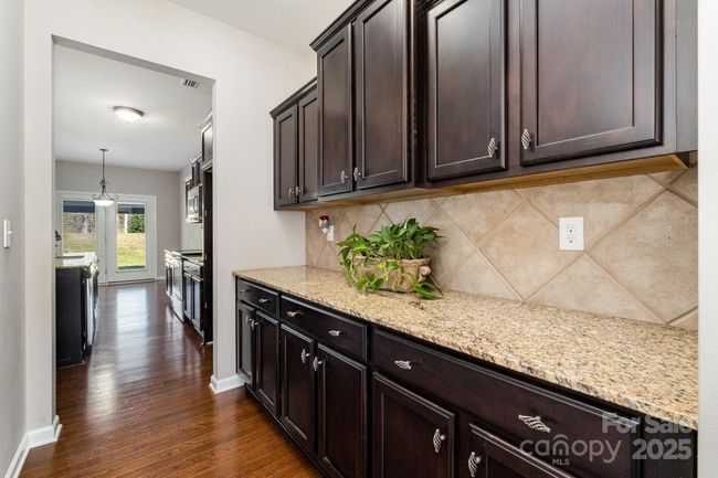 Butler's pantry offers more cabinetry for storage and countertops for entertaining. | Image 6
