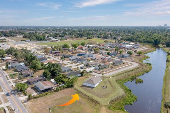 View of property location with a large body of water and nearby suburban area | Image 19