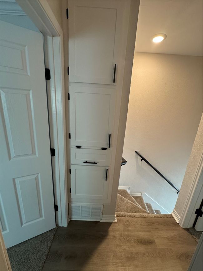 Staircase with wood finished floors and baseboards | Image 15