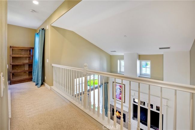 Convenient bridge walkway from primary bedroom to guest room offers privacy for all | Image 21