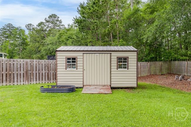 Storage shed for yard tools or recreational items. | Image 45
