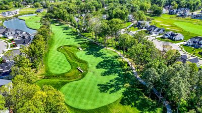 Picturesque views of the fairway, mature trees, and waterbodies - Overlooking the Green | Image 2