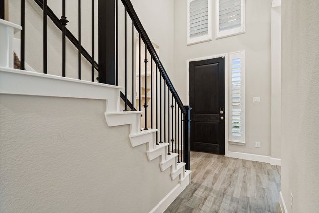 Entryway featuring wood finished floors and stairway | Image 4