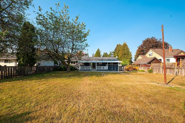 View of fenced backyard | Image 27