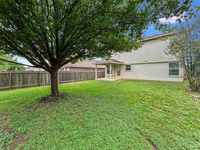 Backyard with a Wooden Fence | Image 23