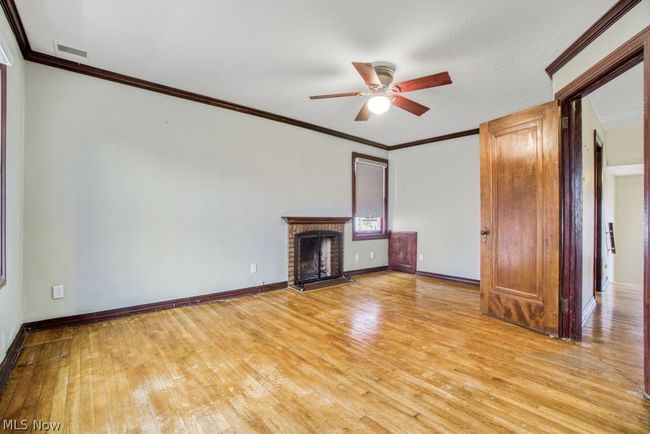 2nd floor owner's suite boasts a charming fireplace | Image 17