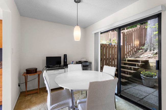Carpeted dining area with plenty of natural light | Image 11