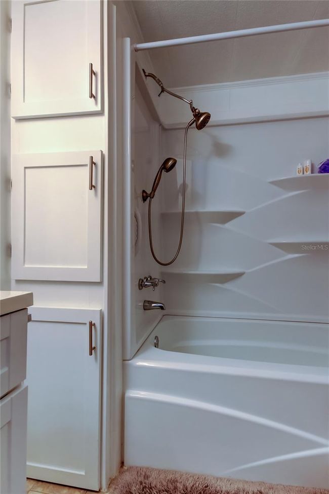 45.. FULLY UPDATED Guest Bathrm (8.8' x 6.5') Newer Spotless Tub w Multiple Shelves + 3 Deep Storage Cabinets!!. | Image 44