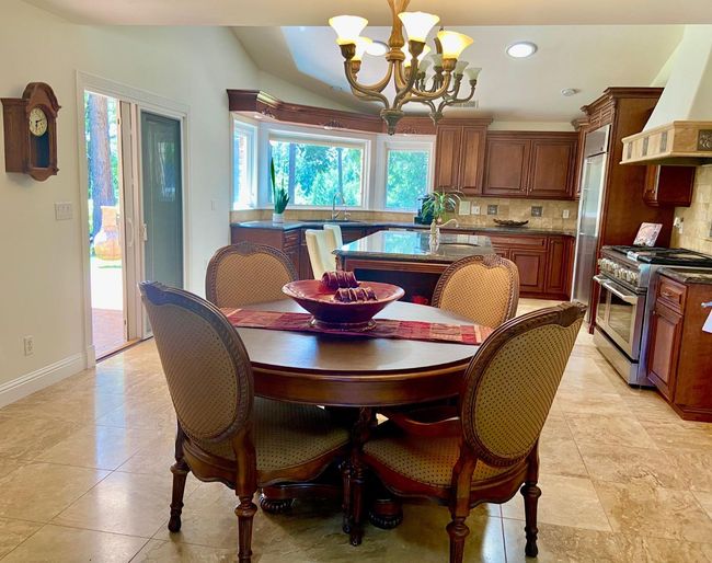 Dining area in kitchen is spacious enough for a large table when you add the leaves for entertaining! | Image 25