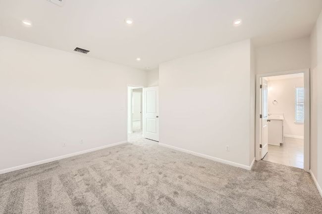 Empty room featuring visible vents, recessed lighting, light colored carpet, and baseboards | Image 15