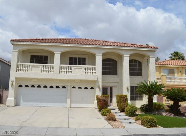 Mediterranean / spanish-style house with a garage, stucco siding, driveway, a balcony, and a tile roof | Image 30