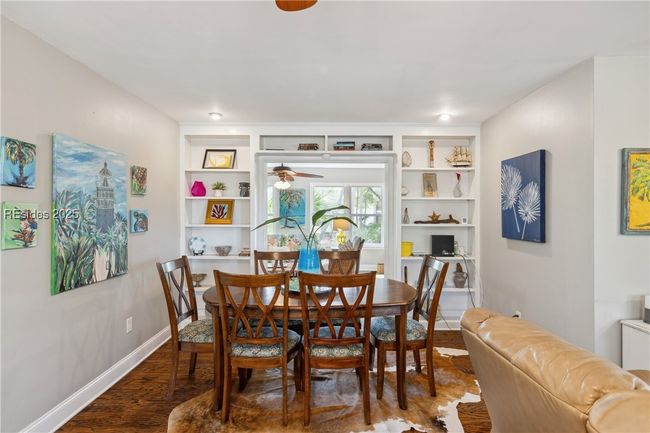 Spacious dining area, hardwood floors, and stylish built in shelving adds characters and richness. | Image 29