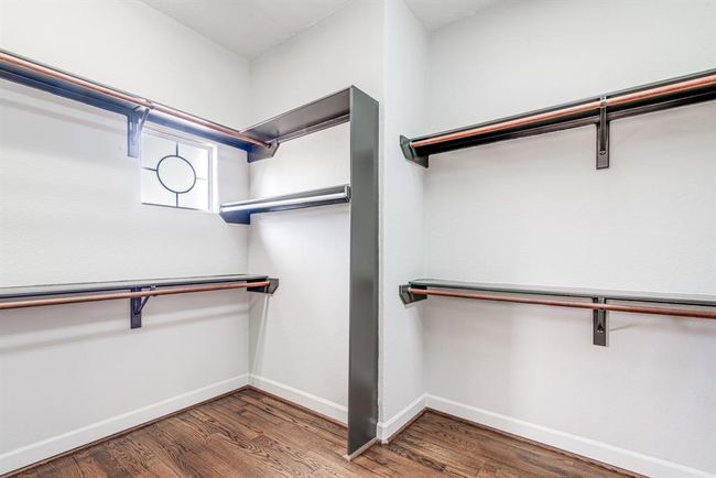Walk in primary closet with built in organization. So much hanging space. | Image 10