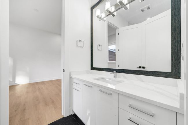 Bathroom with vanity and baseboards | Image 14