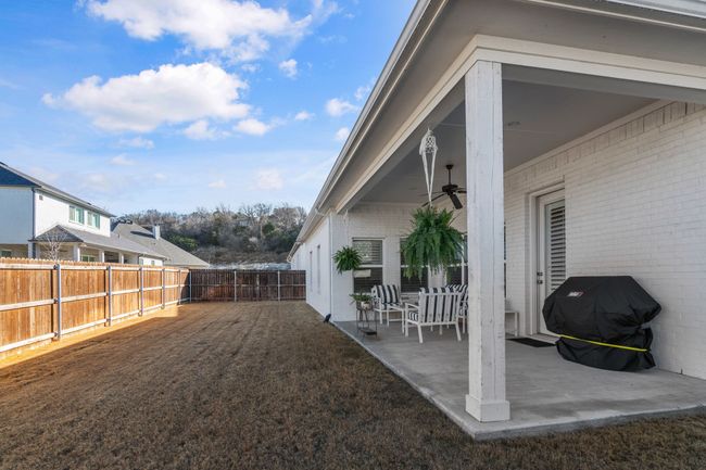 View of yard with a patio, a ceiling fan, and a fenced backyard | Image 25