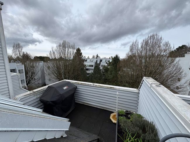View of patio / terrace with a balcony and area for grilling | Image 17