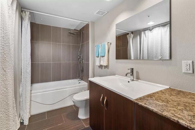Bathroom with vanity and shower / bath combo with shower curtain | Image 25
