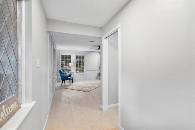Enter into the spacious open-concept first floor with a neutral palette. | Image 4