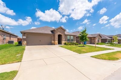 Ranch-style house with a garage, central AC unit, and a front yard | Image 3