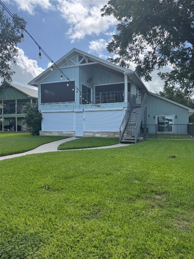 View of front of property with a front yard and stairs | Image 33