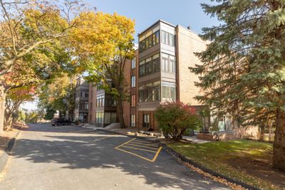 Nestled into Trees on this Top Floor Corner! | Image 1