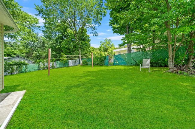 View of yard with volleyball court | Image 34