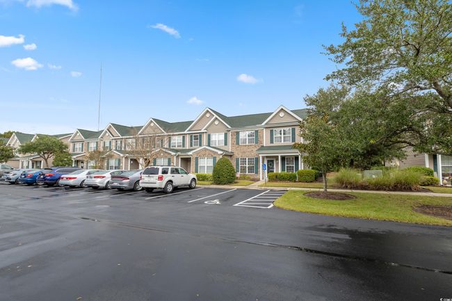Uncovered parking lot featuring a residential view | Image 39